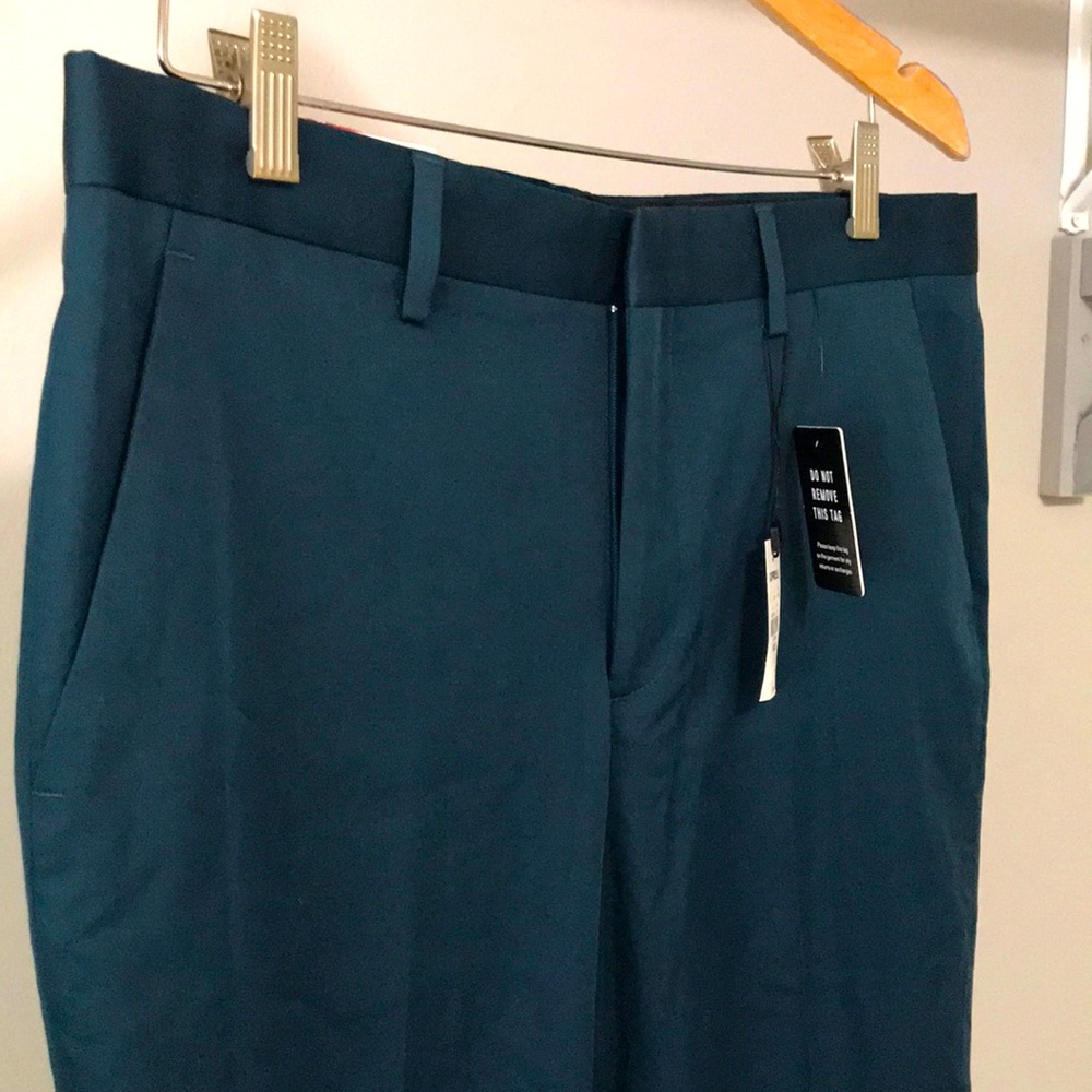 Brand new express size 33 x 30 dress pant in an aqua blue color
